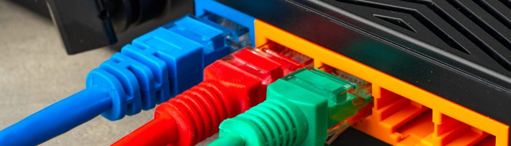 Modern router with cables plugged in close up Modern router with cables plugged in close up photo